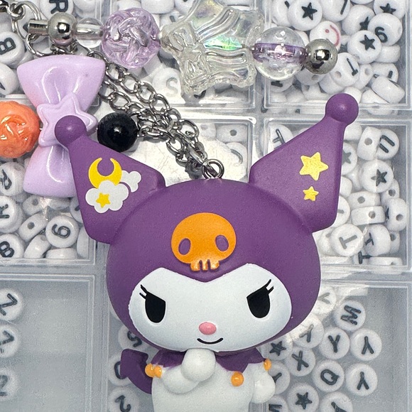 Cute Hello Kitty Character Keychains with Purple and Orange Accents - Picture 6 of 7